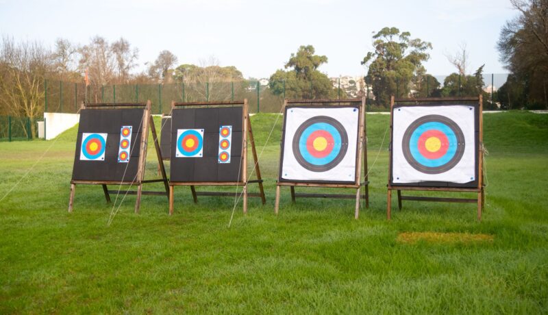 Outdoor archery targets on a grassy field in Portugal, ideal for sports practice.