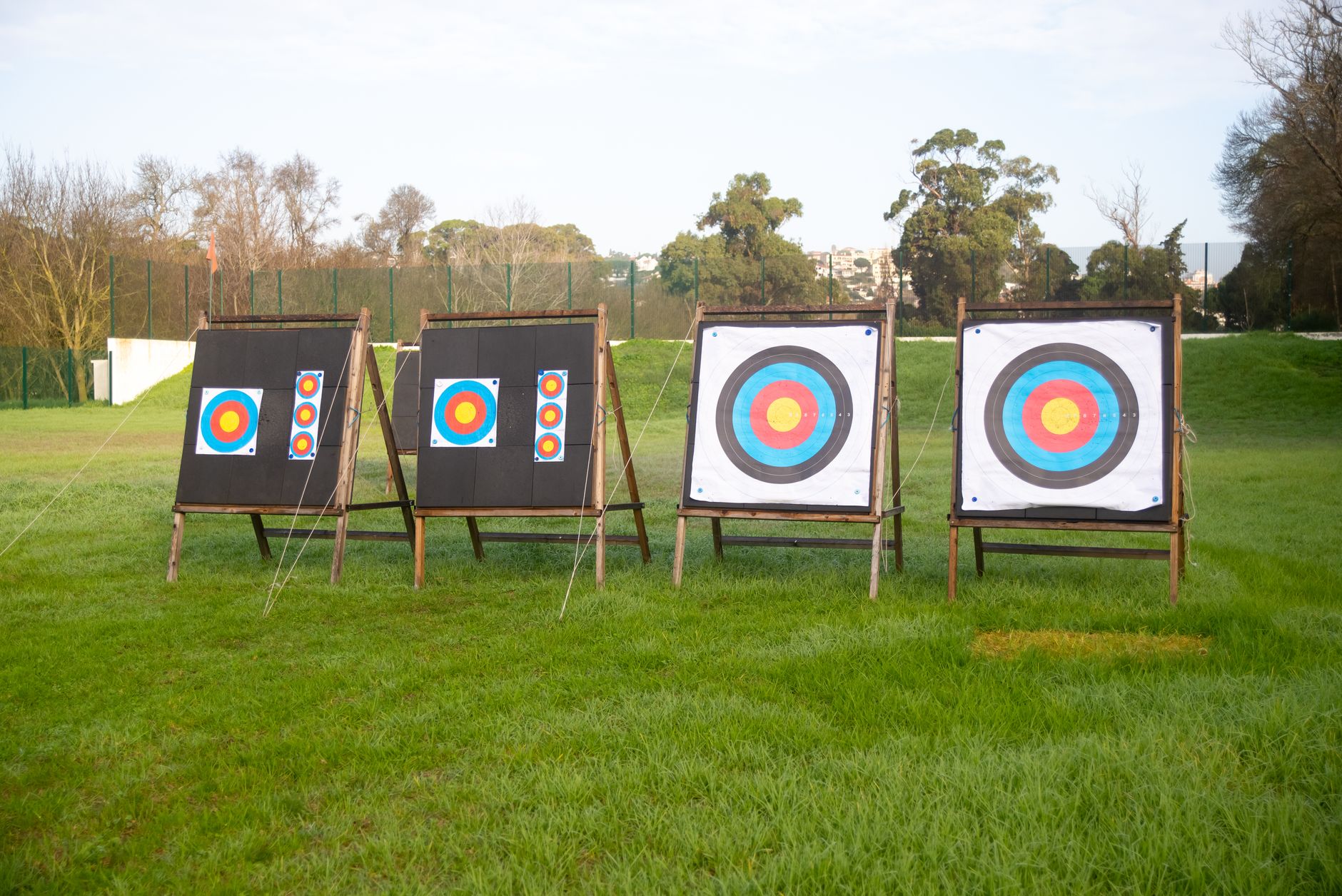 Outdoor archery targets on a grassy field in Portugal, ideal for sports practice.
