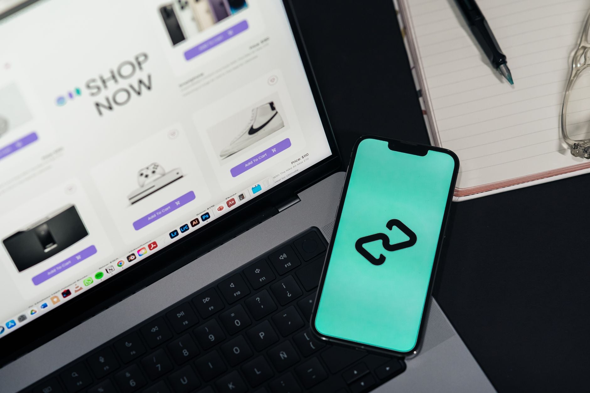 Value Proposition Development: Turn Features Into Reasons to Buy 1 A smartphone and laptop displaying online shopping platforms, suggesting digital retail.