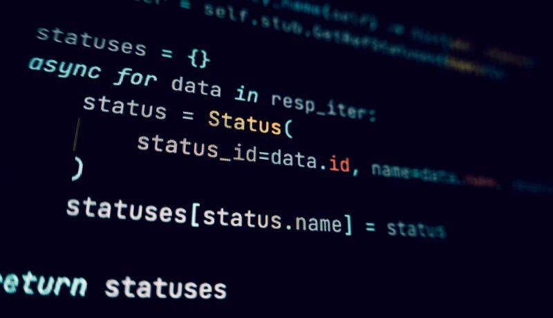 Detailed view of programming code in a dark theme on a computer screen.